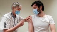 FILE PHOTO: A volunteer receives a dose of CureVac vaccine or a placebo during a study by the German biotech firm CureVac as part of a testing for a new vaccine against the coronavirus disease (COVID-19), in Brussels, Belgium March 2, 2021. REUTERS/Yves H