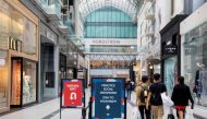 FILE PHOTO: People walk in the Eaton Centre shopping mall. REUTERS/Carlos Osorio/File Photo