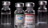 FILE PHOTO: Vials with Pfizer-BioNTech and Moderna coronavirus disease (COVID-19) vaccine labels are seen in this illustration picture taken March 19, 2021. REUTERS/Dado Ruvic/Illustration/File Photo

