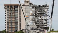 Emergency workers conduct search and rescue efforts at the site of a partially collapsed residential building in Surfside, near Miami Beach, Florida, U.S. June 29, 2021. REUTERS/Joe Skipper
