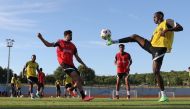 Qatar players during a training session yesterday.