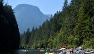 People cool off in Alouette Lake during the scorching weather of a heatwave in Maple Ridge, British Columbia, Canada June 28, 2021. REUTERS/Jennifer Gauthier
