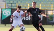 Qatar’s Bassem Al Rawi (left) in action yesterday. 