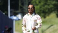 Mercedes' Lewis Hamilton arrives at the circuit ahead of practice. (Reuters/Leonhard Foeger)