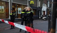 Police officers stand guard to secure the area where Dutch celebrity crime reporter Peter R. de Vries, known for his reporting on some of the most renowned criminals in the Netherlands, was reportedly shot and seriously injured, in Amsterdam, Netherlands,