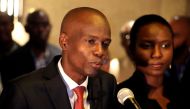 Jovenel Moise addresses the media next to his wife Martine after winning the 2016 presidential election, in Port-au-Prince, Haiti. Picture taken November 28, 2016. REUTERS/Jeanty Junior Augustin/File Photo