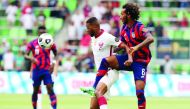 Action during the Concacaf Gold Cup semi-final between Qatar and USA yesterday.