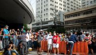 Filipinos waiting to be vaccinated against the coronavirus disease (COVID-19) gather outside a mall, a day before stricter lockdown measures are implemented, in Manila, Philippines, August 5, 2021. REUTERS/Lisa Marie David