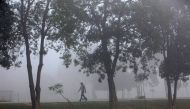 Man walks through a thick layer of smog in Pakistan. File photo for representational purposes only.