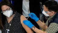 File photo: Philippines' Health Secretary Francisco Duque vaccinates a health worker with Sinovac Biotech's Coronavac on the first day of the coronavirus disease (COVID-19) inoculation drive in the Philippines, at the Lung Center of the Philippines, Quezo