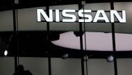 A man is silhouetted at a show room of Nissan Motor Co. in Tokyo, Japan, February 12, 2019. REUTERS/Kim Kyung-hoon/File Photo/File Photo