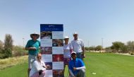 Golfers pose for a group photo after the event.