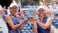 Shuai Zhang of China, left, and Samantha Stosur of Australia pose with the women's doubles championship trophy on day fourteen of the 2021 U.S. Open tennis tournament at USTA Billie Jean King National Tennis Center. Mandatory Credit: Danielle Parhizkaran-