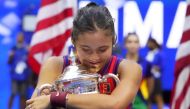 Emma Raducanu of Great Britain celebrates with the championship trophy at USTA Billie Jean King National Tennis Center. (Robert Deutsch-USA TODAY Sports)
