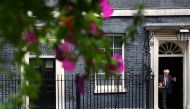 Britain's Prime Minister Boris Johnson gestures as he walks outside Downing Street in London, Britain, September 15, 2021. Reuters/Hannah McKay