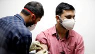 FILE PHOTO: : A medic administers COVAXIN, an Indian government-backed experimental COVID-19 vaccine, to a health worker during its trials, at the Gujarat Medical Education & Research Society in Ahmedabad, India, November 26, 2020. REUTERS/Amit Dave/File 