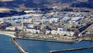 FILE PHOTO: An aerial view shows the storage tanks for treated water at the tsunami-crippled Fukushima Daiichi nuclear power plant in Okuma town, Fukushima prefecture, Japan February 13, 2021, in this photo taken by Kyodo. Picture taken February 13, 2021.