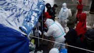 People line up for nucleic acid testing in the snow at a testing site in Jinpu New Area, following cases of the coronavirus disease (COVID-19) in Dalian, Liaoning province, China November 8, 2021. Picture taken November 8, 2021. cnsphoto via REUTERS