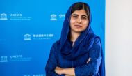 :FILE PHOTO: Nobel Peace Prize laureate Malala Yousafzai poses for photographs during the Education and Development G7 Ministers Summit in Paris, France, July 5, 2019. Christophe Petit Tesson/Pool via REUTERS/File Photo
