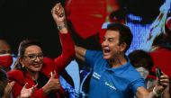 Xiomara Castro, presidential candidate of the Liberty and Refoundation Party (LIBRE), and vice presidential candidate Salvador Nasrala react after the closing of the general election in Tegucigalpa, Honduras, November 28, 2021. Reuters/Jose Cabezas