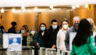 People wait in a general screening line at a security checkpoint at Seattle-Tacoma International Airport before the Thanksgiving holiday in Seattle, Washington, U.S. November 24, 2021. REUTERS/Lindsey Wasson