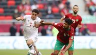 Jordan's Mohamed Zraiq in action with Morocco's Mohammed Ali Bemammer Reuters/Ibraheem Al Omari