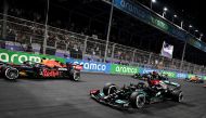 Red Bull's Max Verstappen in action with Mercedes' Lewis Hamilton and Mercedes' Valtteri Bottas during the race Pool via REUTERS/Andrej Isakovic