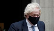 Britain's Prime Minister Boris Johnson walks outside Downing Street in London, Britain, December 8, 2021. REUTERS/Peter Nicholls
