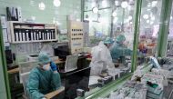 FILE PHOTO: Health workers are seen at work as the Slovak government mandates further restrictions to curb the spread of COVID-19), in Trencin, Slovakia, November 25, 2021. REUTERS/Radovan Stoklasa/File Photo
