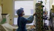 A medical staff member works in the Intensive Care Unit (ICU) for COVID-19 patients at La Timone hospital in Marseille, as France is seeing an increase in coronavirus disease (COVID-19) cases and hospitalisations, France, December 10, 2021. REUTERS/Eric Gaillard