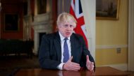 British Prime Minister Boris Johnson gestures as he records an address to the nation, to provide an update on the booster vaccine COVID-19 programme at Downing Street, London, Britain December 12, 2021. Kirsty O'Connor/Pool via REUTERS
