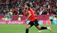 Egypt’s Ahmed Refaat celebrates scoring their second goal against Jordan.