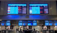 Digital display boards show cancelled flights to London - Heathrow at O.R. Tambo International Airport in Johannesburg, South Africa, November 26, 2021. REUTERS/ Sumaya Hisham/File Photo


