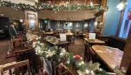 Empty tables are seen in a restaurant amid the coronavirus disease (COVID-19) pandemic in London, Britain, December 18, 2021. REUTERS/Peter Nicholls/File Photo
 