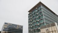 FILE PHOTO: The World Health Organization logo is pictured outside the old and the new WHO buildings, in Geneva, Switzerland, December 20, 2021. REUTERS/Denis Balibouse/File Photo
