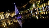 People wait in line on the day before Christmas eve to do tests for the coronavirus disease (COVID-19) in Rossio square, LISBON, Portugal, December 23, 2021. Picture taken December 23, 2021. REUTERS/Pedro Nunes
