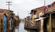 A man uses a canoe to visit his flooded house during floods caused by heavy rain in Maraba, Para state, Brazil January 9, 2022. REUTERS/Ueslei Marcelino
