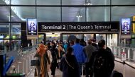 People queue to enter terminal 2, as tighter rules for international travellers start, at Heathrow Airport, amid the spread of the coronavirus disease (COVID-19) pandemic, London, Britain, January 18, 2021. REUTERS/Henry Nicholls/File Photo

