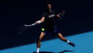 Serbian tennis player Novak Djokovic practices at Melbourne Park as questions remain over the legal battle regarding his visa to play in the Australian Open in Melbourne, Australia, January 12, 2022. Reuters/Loren Elliott