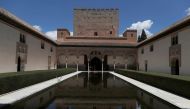 FILE PHOTO: Tourists visit the Alhambra Palace in Granada, Spain June 17, 2020. REUTERS/Jon Nazca/File Photo
