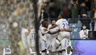 Real Madrid's Karim Benzema celebrates scoring their second goal with teammates REUTERS/Albert Gea