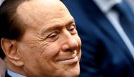 FILE PHOTO: Italy's former prime minister, Silvio Berlusconi, reacts after casting his vote during Italian elections for mayors and councillors, in Milan, Italy, October 3, 2021. REUTERS/Flavio Lo Scalzo/File Photo
