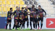 Umm Salal players celebrate after Aymen Hussein scored their second goal against Al Shamal, yesterday.