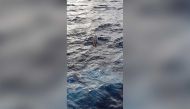 A row boat is seen overturned at sea after Portuguese navy said French adventurer Jean-Jacques Savin, 75, who set off in a row boat from Portugal on January 1, in an attempt to cross the Atlantic solo, has disappeared at sea and the boat was found empty and overturned at sea near the Azores archipelago, January 21, 2022. Portuguese Navy/Handout via REUTERS
