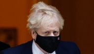 British Prime Minister Boris Johnson walks outside Downing Street in London, Britain, January 25, 2022. REUTERS/Peter Cziborra