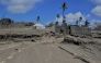 A general view shows damaged buildings and landscape covered with ash following the volcanic eruption and tsunami in Kanokupolu, Tonga, January 23, 2022. Tonga Red Cross Society/Handout via Reuters
