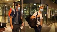 Andy Murray and Denis Shapovalov arrive at the Hamad International Airport ahead of the Qatar ExxonMobil Open.