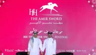 Acting CEO of QREC Bader Mohamed Al Darwish (right) and CEO of Al Emadi Enterprises and Al Hazm Mohamed Abdul Karim Al Emadi during the draw ceremony for HH The Amir Sword Festival yesterday.