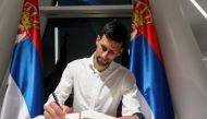 Tennis player Novak Djokovic signs the honour book as he visits the Serbia pavilion at Expo 2020 for the presentation of the Novak Djokovic Foundation, in Dubai, United Arab Emirates, February 17, 2022. REUTERS/Satish Kumar