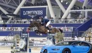 Martin Fuchs guides Conner Jei over a fence during the 1.55m jump-off at the Longines Arena, yesterday.